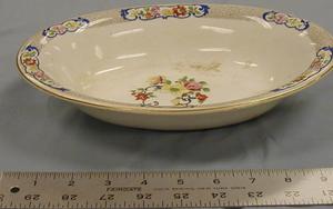 [John Maddock and Sons Royal Vitreous oval shaped serving bowl with gold rim]