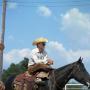 Primary view of [Cowboy on his horse at Cowtown Daze]