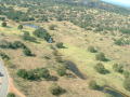 Thumbnail image of item number 1 in: '[Aerial view of land and road]'.