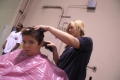 Photograph: [A Student Receiveing a Hair Cut]