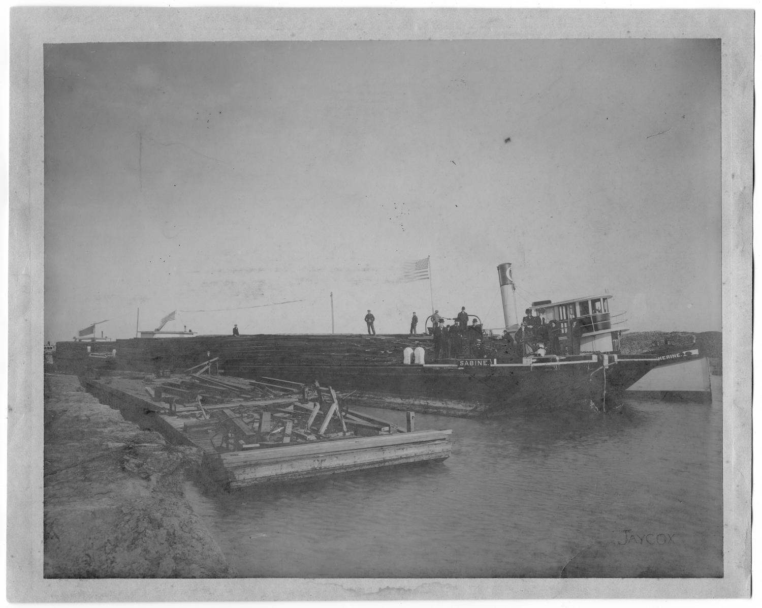 [Photograph of the First Boat Through a New Canal, January 24,1908]
                                                
                                                    [Sequence #]: 1 of 2
                                                