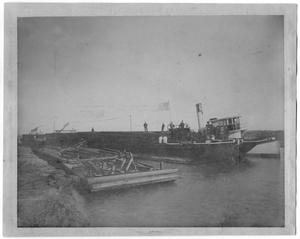 Primary view of object titled '[Photograph of the First Boat Through a New Canal, January 24,1908]'.