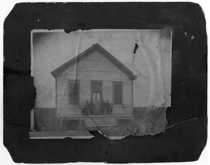Primary view of object titled '[Photograph of Students and Teacher in Front of the Farm School, 1906]'.