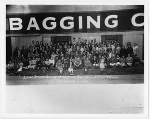 Primary view of object titled '[Group outside of Lone Star Bag and Bagging Company]'.