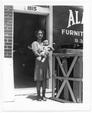 [Girl with baby, Alamo Furniture Company shop]