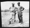 Thumbnail image of item number 1 in: '[Two soldiers, standing outside of barracks]'.