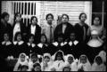 Primary view of [Young women and children with a nun]