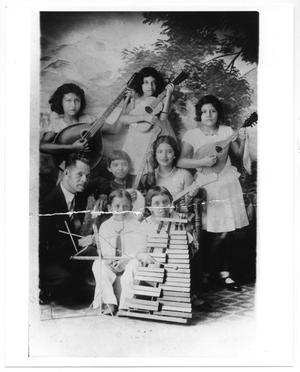 [Photograph of young boys and girls with instruments]