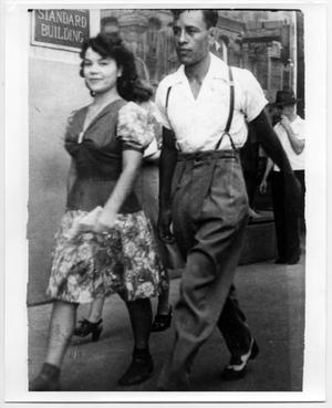[Couple walking down Main Street]