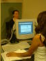 Thumbnail image of item number 1 in: '[Woman with computer photographing another woman]'.