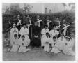 Photograph: [Catechism school graduates with priest]
