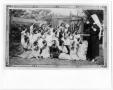 Photograph: [Catechist teaching children the sign of the cross]