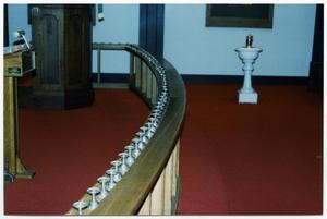 [Silver Communion Cups Lining a Banister Inside Danevang Lutheran Church]
