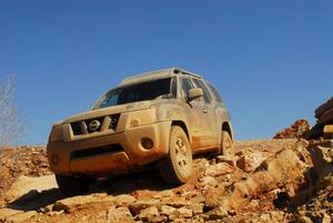Primary view of object titled '[Dirty SUV  descending rocky slope]'.