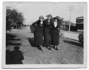 [Three Similarly Dressed Women Standing on a Lawn in San Antonio]