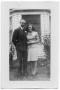 Photograph: [Melvin Hansen and Margie Hansen Standing On the Lawn in Front of a B…