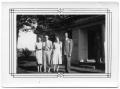 Photograph: [Hansen Family Relatives Standing on the Lawn of a White Building]