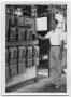 Thumbnail image of item number 1 in: '[Benedict Krag Standing By Grain Elevator Controls at the Danevang Farmers Co-op]'.