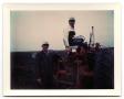 Primary view of [Carl and Curtis Jensen Working with a Tractor on Their Farm]