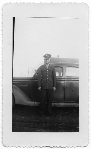 [Melvin Hansen in Front of Automobile]