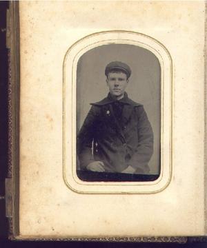 Primary view of object titled '[Unidentified young man wearing dark clothing and a hat]'.