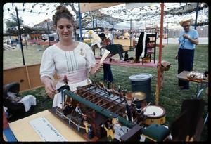 [Woman Demonstrating Historic Toy]