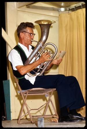 [Tuba Player in Boerne Village Band Holding Sheet Music]