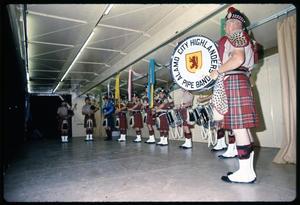 [Alamo City Highlanders Pipe Band Performs Onstage at Night]