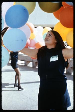 [Woman Releasing Balloons]