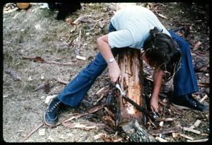[Boy Shaving Wooden Log]
