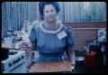 Photograph: [Woman Holding a Tray of Peanut Brittle]