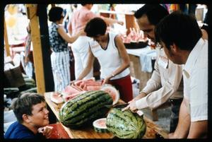 Primary view of object titled '[Man Slicing Watermelon]'.