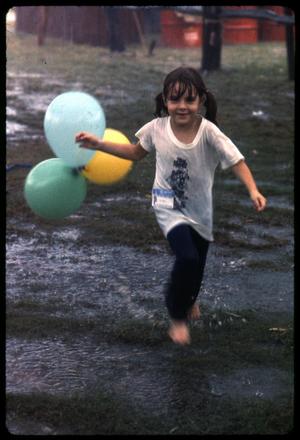 [Girl Running With Balloons in the Rain]