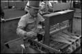Photograph: [Weaver Operating a Loom]