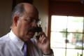 Primary view of [Hector Flores talking on cellular phone]