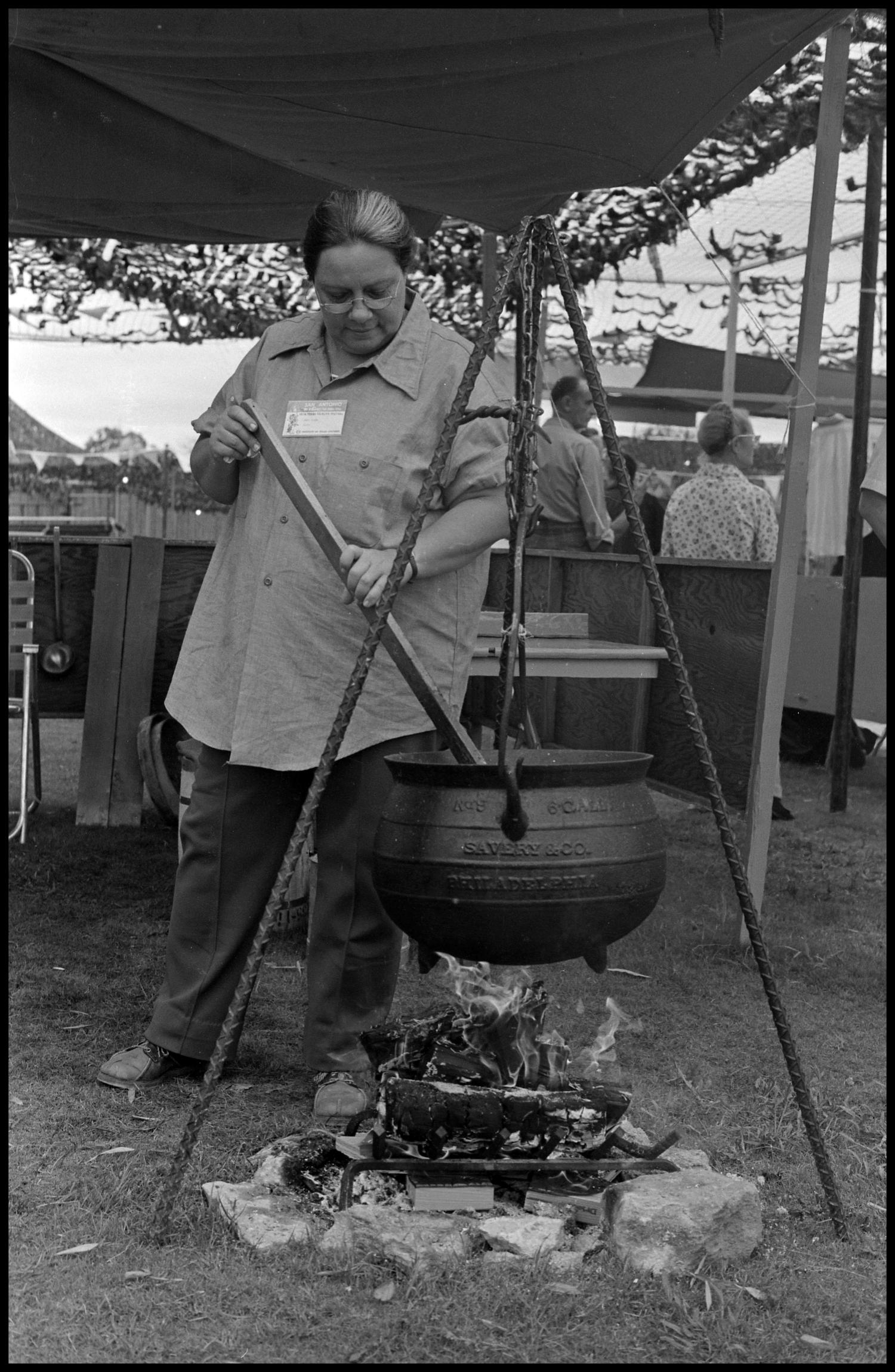 Woman stirring a large pot] - The Portal to Texas History