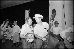 [Two Members of the East Texas String Ensemble Performing]