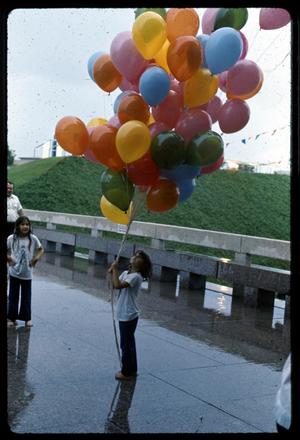 [Girl Holding a Bunch of Balloons]