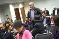 Primary view of [Attendee speaking at microphone]