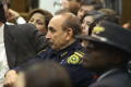 Primary view of [Officer of the Dallas County Sheriff's Office listening]