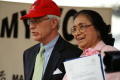 Thumbnail image of item number 1 in: '[Adelfa Callejo standing next to man with red cap]'.