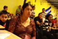 Photograph: [Woman listens to speaker in the El Salvador Restaurant]