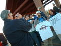 Thumbnail image of item number 1 in: '[Man photographing protesters holding t-shirts]'.