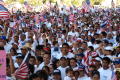 Thumbnail image of item number 1 in: '[Crowd waves American flags]'.