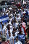 Photograph: [The flag of Honduras is carried during the march]
