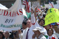 Thumbnail image of item number 1 in: '[Protesters carry signs]'.