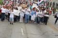 Photograph: [Protesters marching with signs and flags]