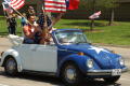 Primary view of [Close-up view of protesters in blue and white Volkswagen Beetle]