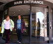 Photograph: [Two people walk out from the John Peter Smith hospital]