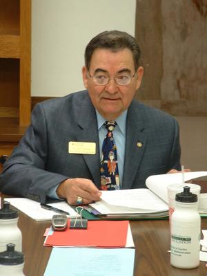 Primary view of object titled '[Rudy Rodriguez takes part in a meeting]'.
